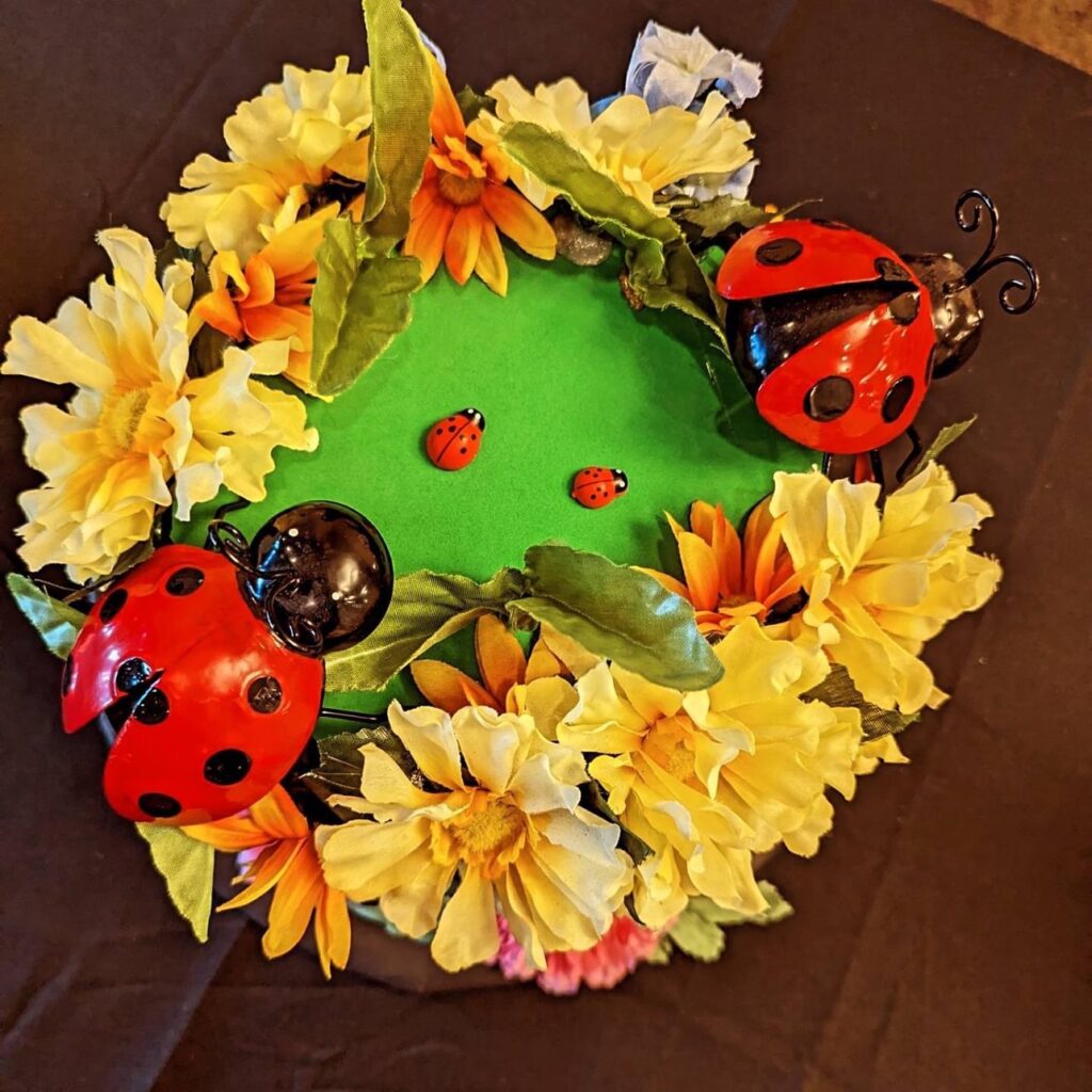 photo of a floral and lady bug mad hat